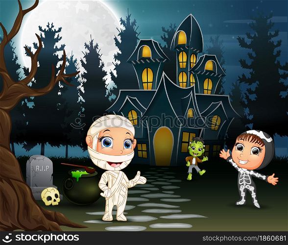 Children celebrate a halloween party outdoors at night