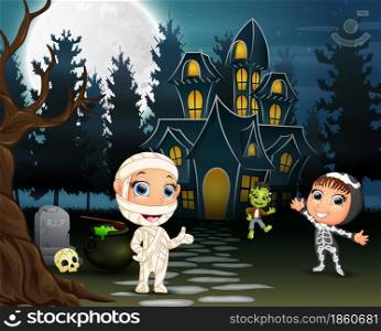 Children celebrate a halloween party outdoors at night