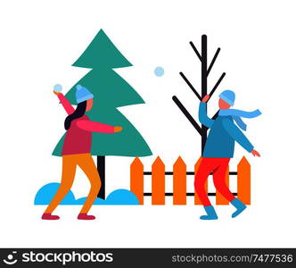 Children playing snowballs at wintertime. Kids fighting with snow near fence with bare tree and fir or spruce. Winter active games, isolated people. Children Kids Playing Snowballs at Wintertime