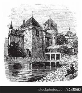 Chillon Castle or Chateau de Chillon in Veytaux, Switzerland, during the 1890s, vintage engraving. Old engraved illustration of a man sitting in front of Chillon Castle, looking at Lake Geneva