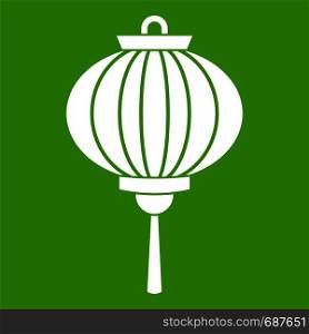Chinese lantern icon white isolated on green background. Vector illustration. Red chinese lantern icon green