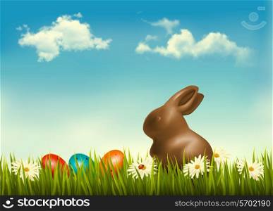 Chocolate bunny with easter eggs in grass. Vector.
