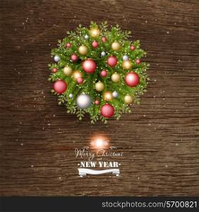 Christmas Card With Pine Branches And Christmas Balls On a Wooden Background