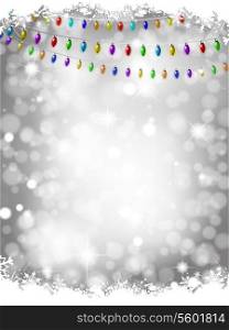 Christmas lights on a silver bokeh lights background with snow