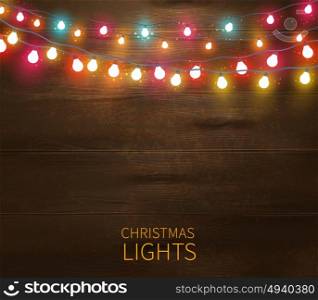 Christmas Lights Poster. Christmas lights poster with shining and glowing garlands on wooden background vector illustration