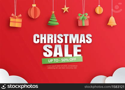 Christmas sale with gifts and elements hanging on red background banner in paper art style.