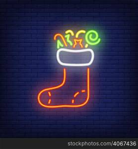 Christmas sock neon sign. Festive design element. Celebration concept for night bright advertisement. Vector illustration in neon style for Christmas, New Year, gifts