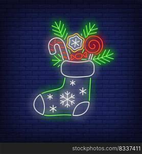 Christmas stocking neon sign. Fir tree, sweets, candies. Vector illustration in neon style for topics like Xmas, dessert, gifts