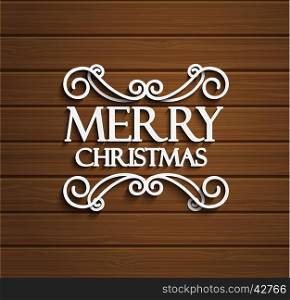 Christmas typographic label for Xmas holidays design. Calligraphic vector Decoration.Wooden background.. Merry Christmas on wooden background.