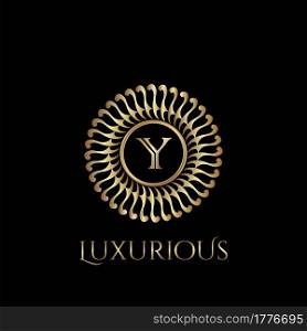 Circle luxury logo with letter Y and symmetric swirl shape vector design logo gold color.
