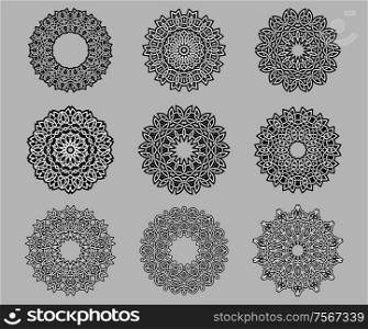 Circular ornate and intricate Celtic ornaments in black and white isolated over grey background