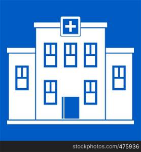 City hospital building icon white isolated on blue background vector illustration. City hospital building icon white