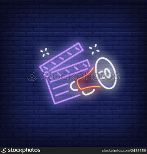 Clapper board and megaphone neon sign. Luminous signboard with film director belongings. Night bright advertisement. Vector illustration in neon style for producing, blogging, cinematography