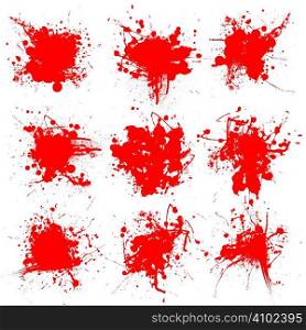 Collection of nine blood splats on a white background
