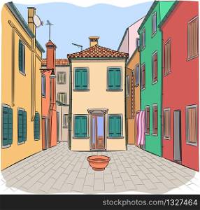 Colorful facades of houses and a traditional courtyard on the island of Burano. Venice. Italy.. Old typical colorful houses on the island of Burano.