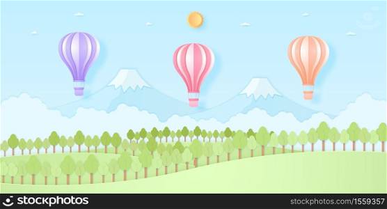 Colorful hot air balloons flying above mountain, Nature hill and trees with sun and blue sky, paper art style