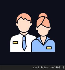 Company staff RGB color icon for dark theme. Man and woman in uniform. Official business representatives. Isolated vector illustration on night mode background. Simple filled line drawing on black. Company staff RGB color icon for dark theme