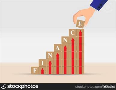 concept of financial growth or financial success, business. Hand is a ladder of cubes with up arrows and letters of the word FINANCE.