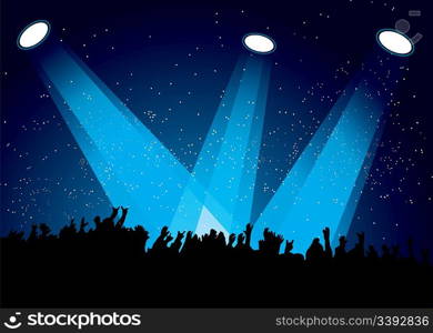 Concert crowd at festival with spotlights night time