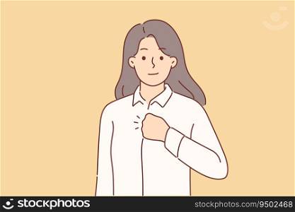 Confident woman puts fist to chest to swear oath or show determination to fight problems. Confident girl in business shirt looking at screen showing pride after achieving career success. Confident woman puts fist to chest to swear oath or show determination to fight problems