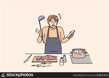 Cooking and preparing food concept. Young confused man in apron standing trying to cook soup boiling and holding smartphone with recipe in hand vector illustration . Cooking and preparing food concept.