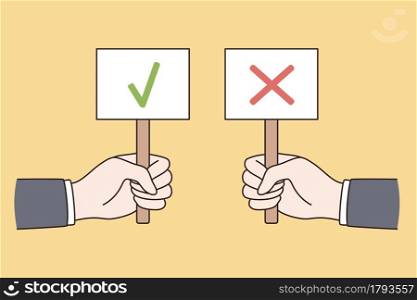 Correct and incorrect signs concept. Hands of people holding signs with green mark approval and red denying symbol over yellow background vector illustration . Correct and incorrect signs concept.