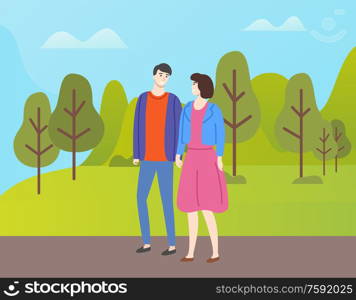 Couple in casual cloth spend time together outdoors. People in love and fall season, man and woman walking in autumn park among yellow and orange trees. Couple in Casual Cloth Spend Time Together Outdoor