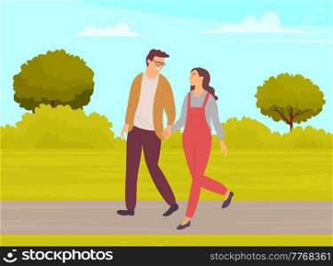 Couple in relationship talking walking in city park together. Young guy and girl holding hands walking in garden, romantic walk. Lovers man and woman on date outdoor. Happy promenade in alley. Couple in relationship talking walking in city park together. Young guy and girl holding hands