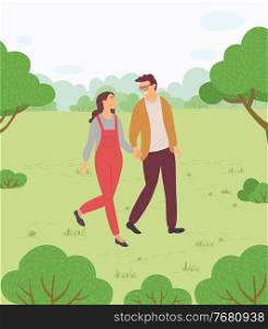 Couple of girl and smiling guy walking in park or countryside, people walk at nature holding hands, woman and man spend leisure time together, outdoors activity, summer view with green hills. Couple of girl and smiling guy walking in park or countryside, people walk at nature holding hands