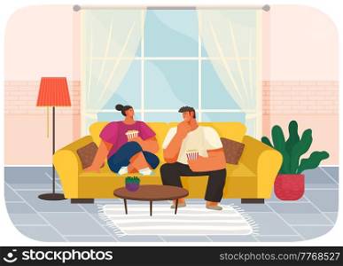 Couple sitting on couch at home in living room interior near big window, eating popcorn and talking. Family stay at home. Man and woman enjoy together, discuss movies. Young family spend time together. Couple sitting on couch at home in living room interior, guy and girl eating popcorn and talking