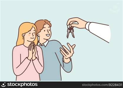 Couple takes keys from hand of realtor or real estate agent who rents out apartment in good area. Cheerful man and woman rejoicing in receiving housing keys at real estate mortgage broker deal. Couple takes keys from hand of realtor or real estate agent who rents out apartment in good area