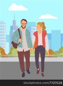 Couple walking down the street. Young bearded guy in glasses and girl holding hands walking in summer day in city park, romantic walk. Pleasant promenade in the open air on a date, active lifestyle. Couple walking down the street. Young guy and girl holding hands walking in summer day in park