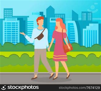 Couple walking in a park. Young guy and girl holding hands walking in summer city alley, romantic walk. Lovers man and woman met on a date outdoor. Romantic promenade in the open air cityscape. Couple walking in a park. Young guy and girl holding hands walking in summer city alley cityscape