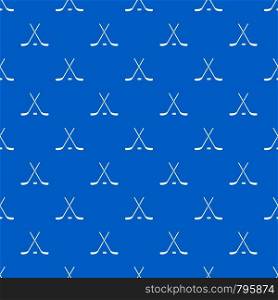 Crossed hockey sticks and puck pattern repeat seamless in blue color for any design. Vector geometric illustration. Crossed hockey sticks and puck pattern seamless blue