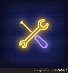 Crossed screwdriver and wrench on brick background. Neon style illustration. Custom motorcycle, repair shop, mechanic. Workshop banner. For service, engineering, maintenance concept