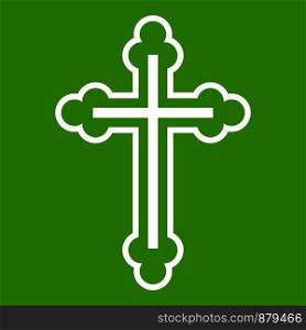 Crucifix icon white isolated on green background. Vector illustration. Crucifix icon green