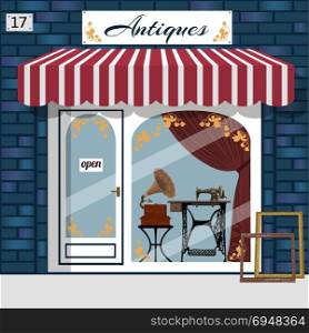 Curiosiry shop . Antiques shop.. Antique shop facade. Gramophone and sewing maching in the window. Blue brick building. Vector illustration.