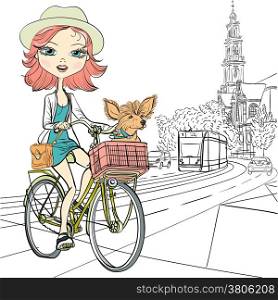 Cute beautiful fashionable girl with dog rides a bike in Amsterdam
