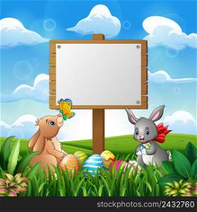 Cute bunnies with easter background and blank sign