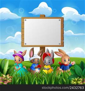 Cute bunnies with easter background and blank sign