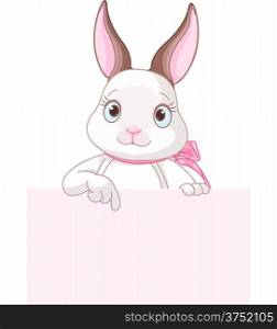 Cute cartoon bunny rabbit peeking round from behind a sign and pointing down