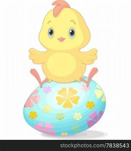 Cute chick sitting on Easter egg