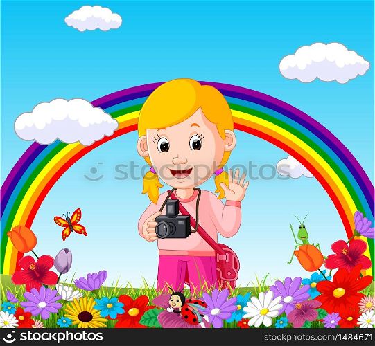 Cute girl in a flower garden with rainbow
