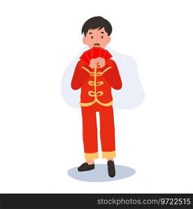 Cute Little Boy in Traditional Chinese Attire Holding Red Envelope. Happy Chinese new year.