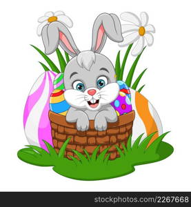 Cute little bunny inside basket in the grass