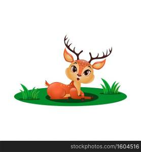 Cute little deer sitting in the grass