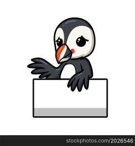 Cute little puffin bird cartoon with blank sign