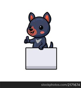 Cute little tasmanian devil cartoon with blank sign and giving thumb up