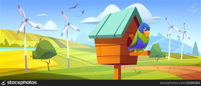 Cute parrot in birdhouse in countryside with green fields and wind turbines. Vector cartoon illustration of spring landscape with river, grass, windmills and funny parrot in wooden bird house. Cute parrot in birdhouse, fields and wind turbines