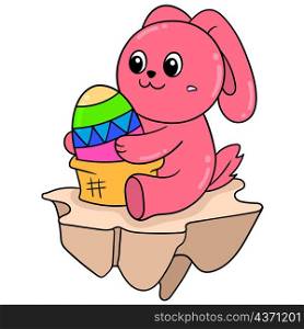 cute red rabbit playing with easter eggs